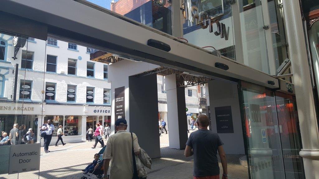 Automatic sliding glass entrance doors