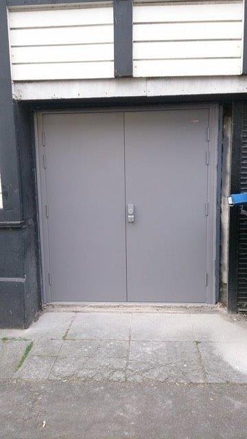 Steel fire doors with emergency exit hardware